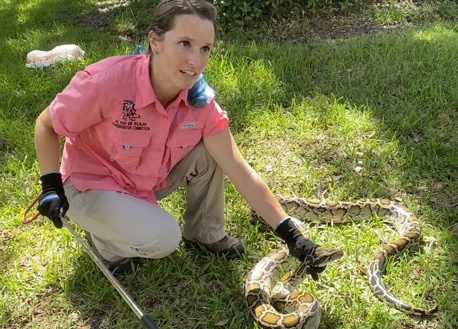 Biologist teach safe handling techniques for pythons