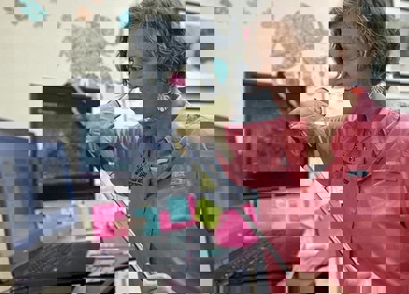 Jan Fore reviewing online materials