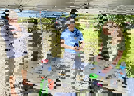 Biologists check in a python at a station