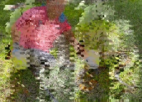 Biologist teach safe handling techniques for pythons